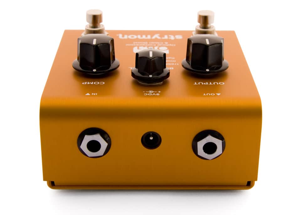 OB.1 - Analog Compressor - Rear View rear view orange guitar pedal showing 2 chrome nose input jacks, recessed DC jack and side profile view of black control knobs