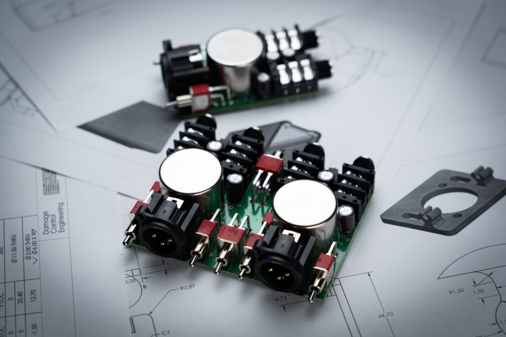 PCH X1 and X2 transformers sitting on top of schematics.